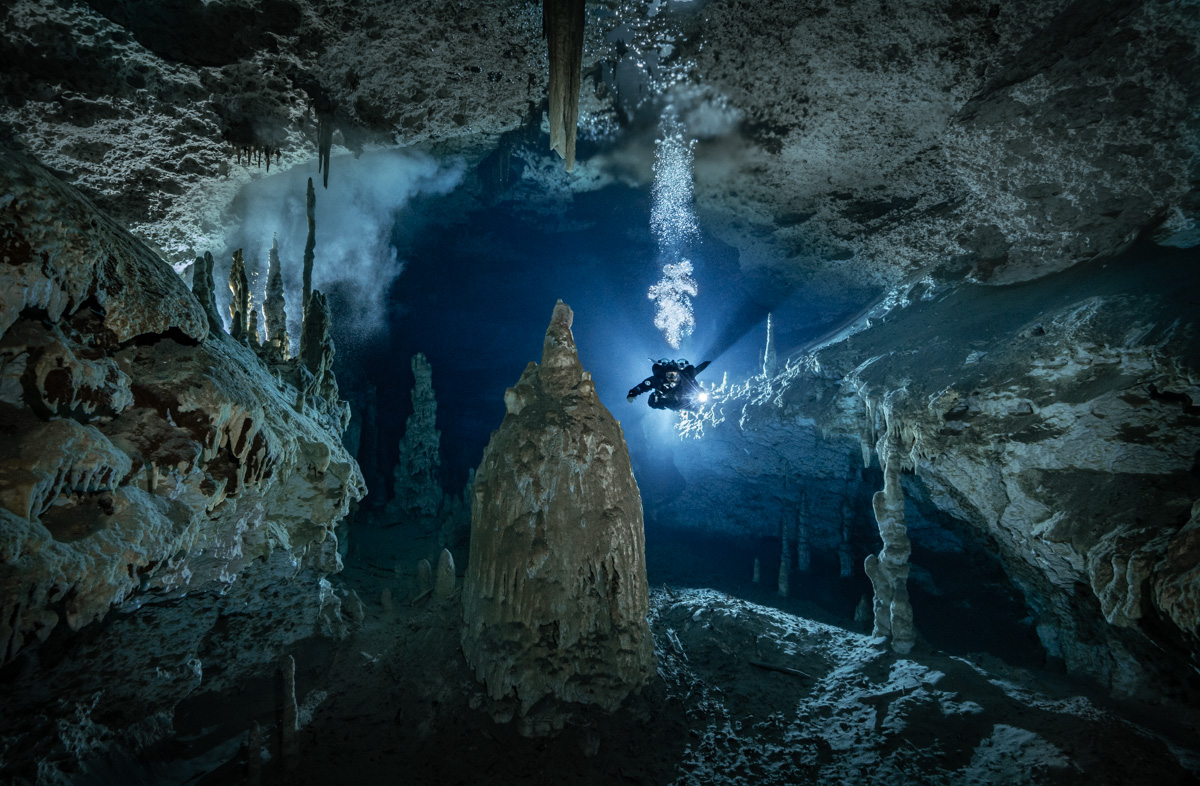 Diver in flooded cave
